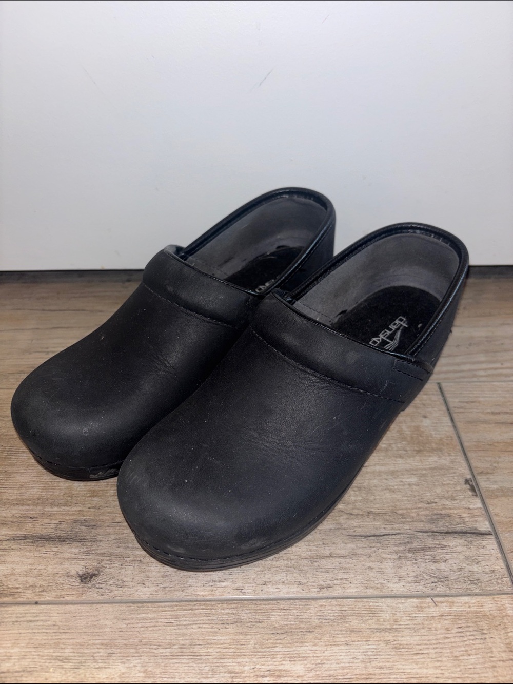 Dansko Black Slip-On Leather Clogs